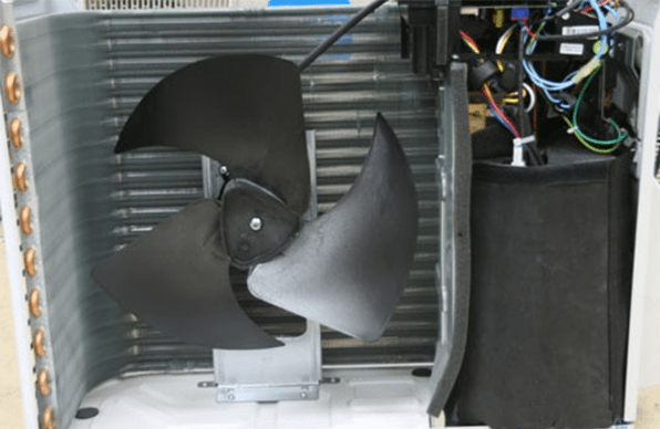 The internal structure of the outdoor unit of the air conditioner, including heat sinks, fans, etc.